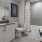 a bathroom with a tub toilet and sink