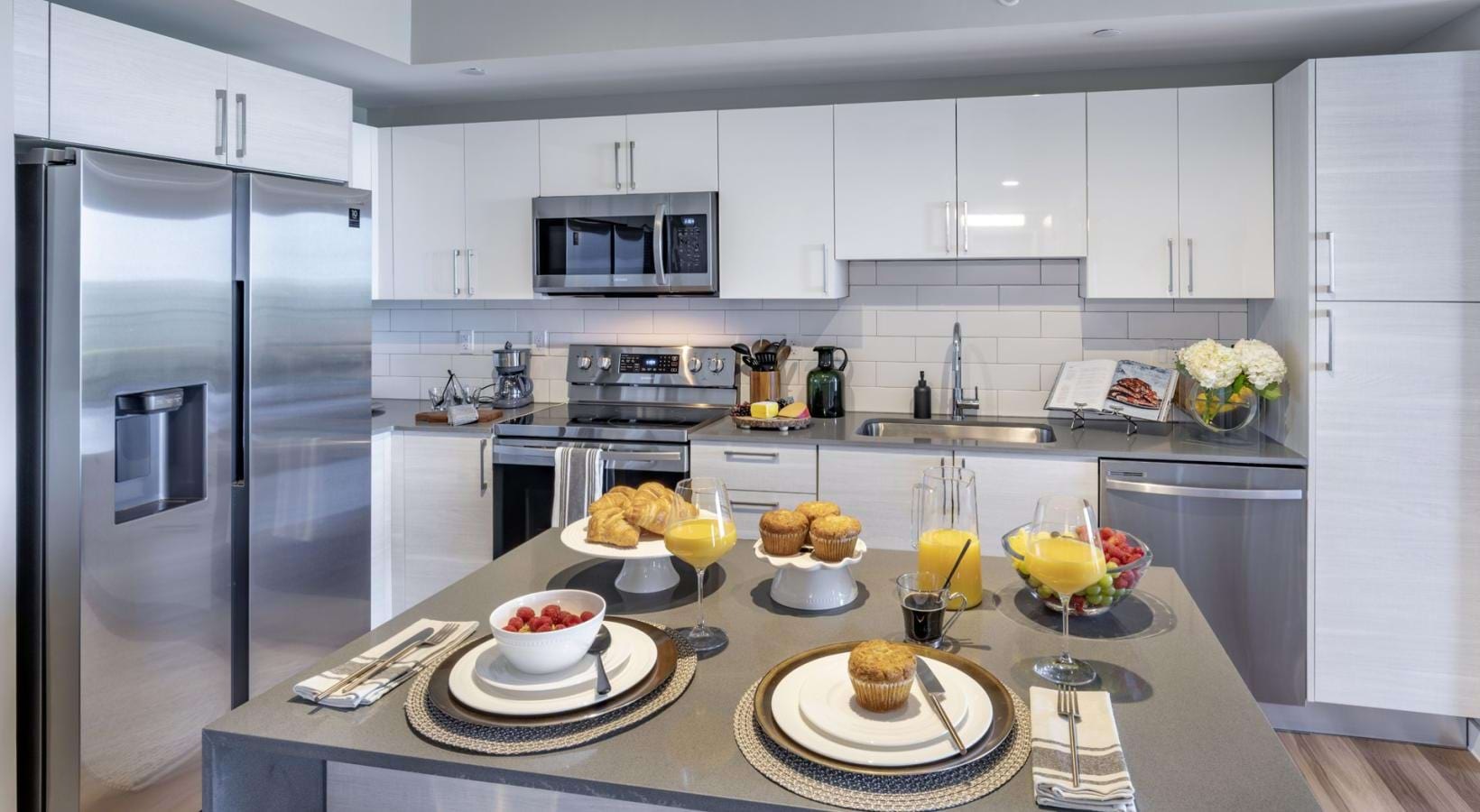 Beautiful kitchens with designer finishes a kitchen with a table and food