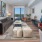 living room with lamp, table, and artwork on the wall