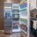 Fridge stocked with a variety of drinks in a kitchen