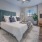bedroom with dresser and lamp on an end-table