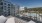 balcony overlooking a swimming pool with chairs