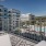 balcony overlooking a swimming pool with chairs