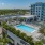 a rooftop swimming pool with palm trees