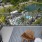 balcony with chairs overlooking a pool