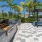 a grill area with trees and a cabana