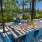 a table and chairs outside under a covered awning