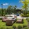 chairs and couches around an outdoor fireplace table