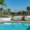 swimming pool with a variety of seating and lounge options
